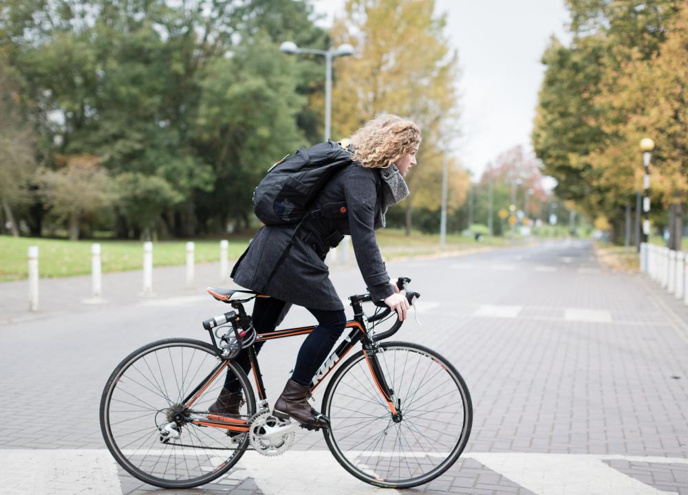 Student cycling through campus