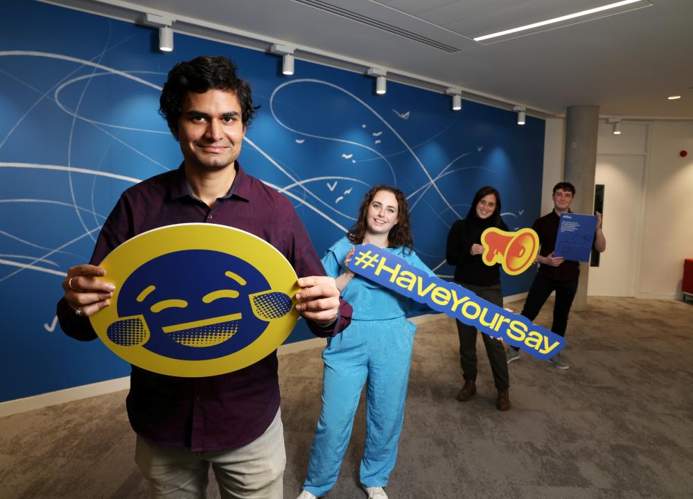 PGR students holding StudentSurvey.ie emojis
